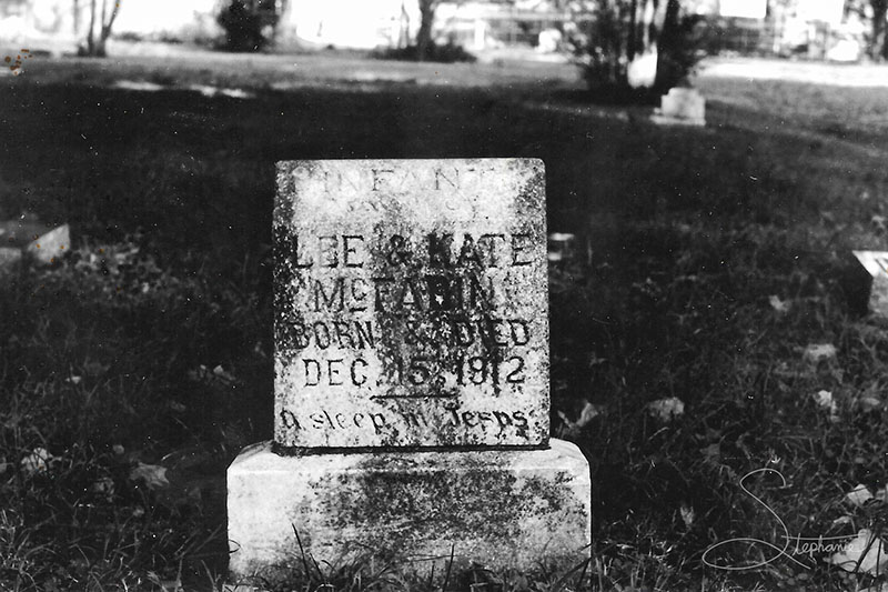 Photo of a headstone from Johnson Station Cemetery in Arlington, Texas. Reads Lee & Kate McFadin. Born & Died Dec 15, 1912.