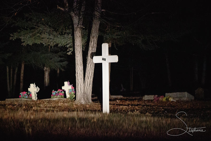 White crosses at night in Birch Hill Cemetery, Fairbanks, Alaska.