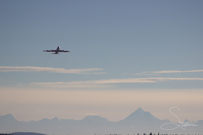 Plane taking flight with the Hayes Range in the background, Eielson Airforce Base Alaska.