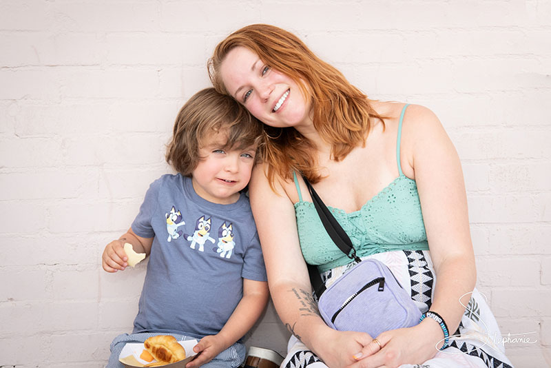 A mother and son having a snack.