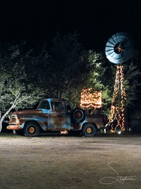 A photo of an old truck at night.