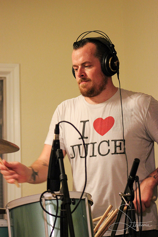 Photo of a drummer at a recording session.