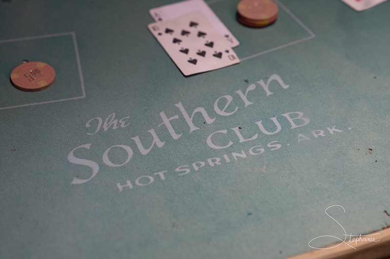 Photo from a museum of a card table from the Southern Club of Hot Springs, Arkansas.