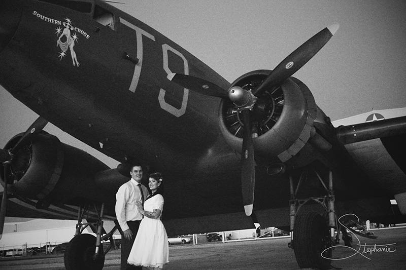 Photo of newly weds in front of C-47 aircraft.